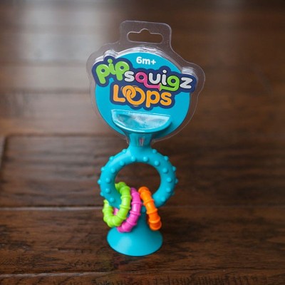 Bobo Przyssawka PipSquigz Loops Fat Brain Toys – niebieska grzechotka sensoryczna dla niemowląt